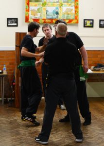 Old School Wing Chun Senior Students Discussing Drills