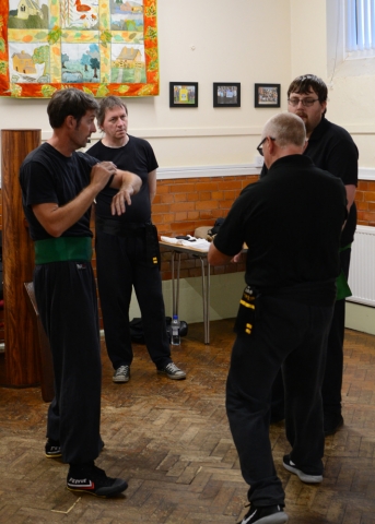 Old School Wing Chun Senior Students Discussing Drills